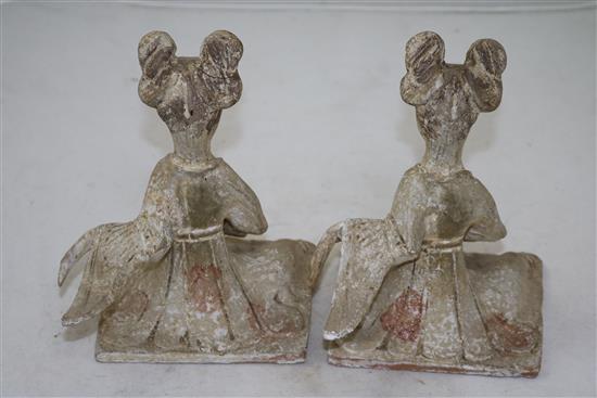 Two Chinese pottery seated figures of ladies, probably Tang dynasty, height 18cm, repairs